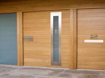 Design Consulting : Altringham . Manchester : Installation of an Urban Oak Entrance door and frame . Natural stain finish 
